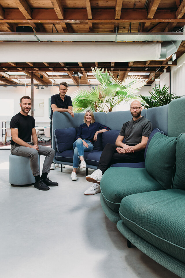 Embrace Royal Ahrend Embrace sofa upholstered in green and blue with designers at HofmanDujardin office in Diemen EB004