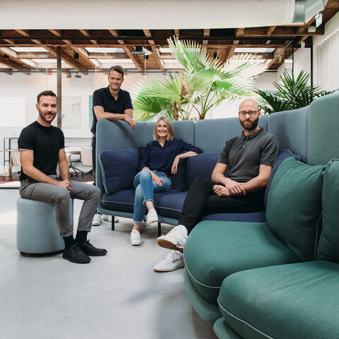 Embrace Royal Ahrend Embrace sofa upholstered in green and blue with designers at HofmanDurjandin office in Diemen EB004