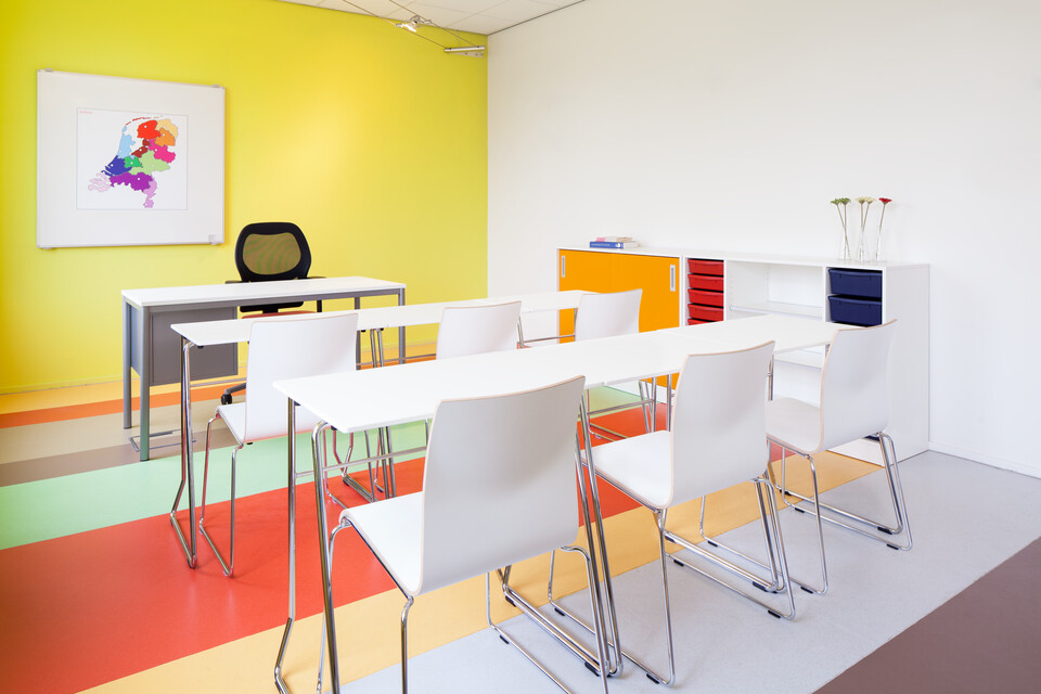 456,370 Royal Ahrend 456 seminar tables with chrome frame and white tops in 2 rows of 3 with 370 wireframe chairs in classroom rear left view