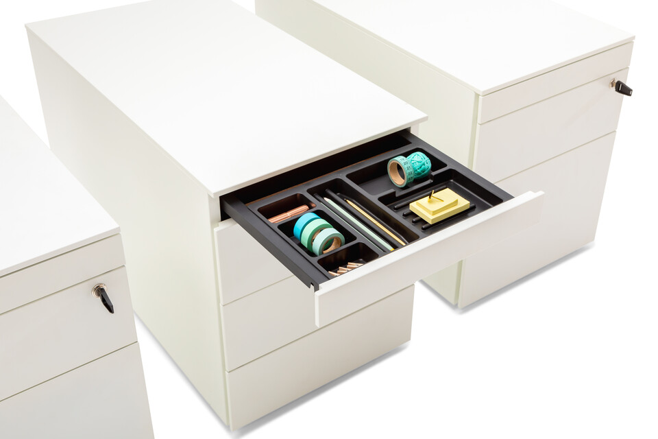 Ladeblok / Pedestal Royal Ahrend Pedestals in white with open pen trays and turquoise office supplies front left detail view