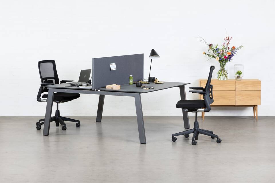 Balance, 2020 Verta Royal Ahrend Balance 4 leg dual workstation in anthracite with charcoal tops and grey screen with black 2020 office chairs front left view
