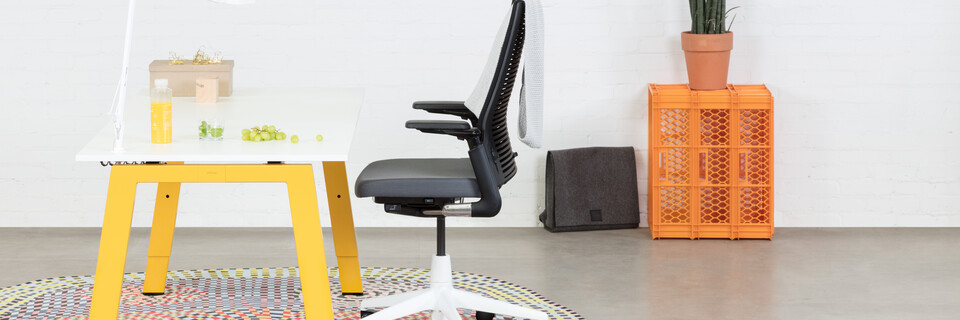 Balance, 2020 Extra Verta Royal Ahrend Balance 4 leg workstation in yellow with white top and grey 2020 office chair with white base left side view